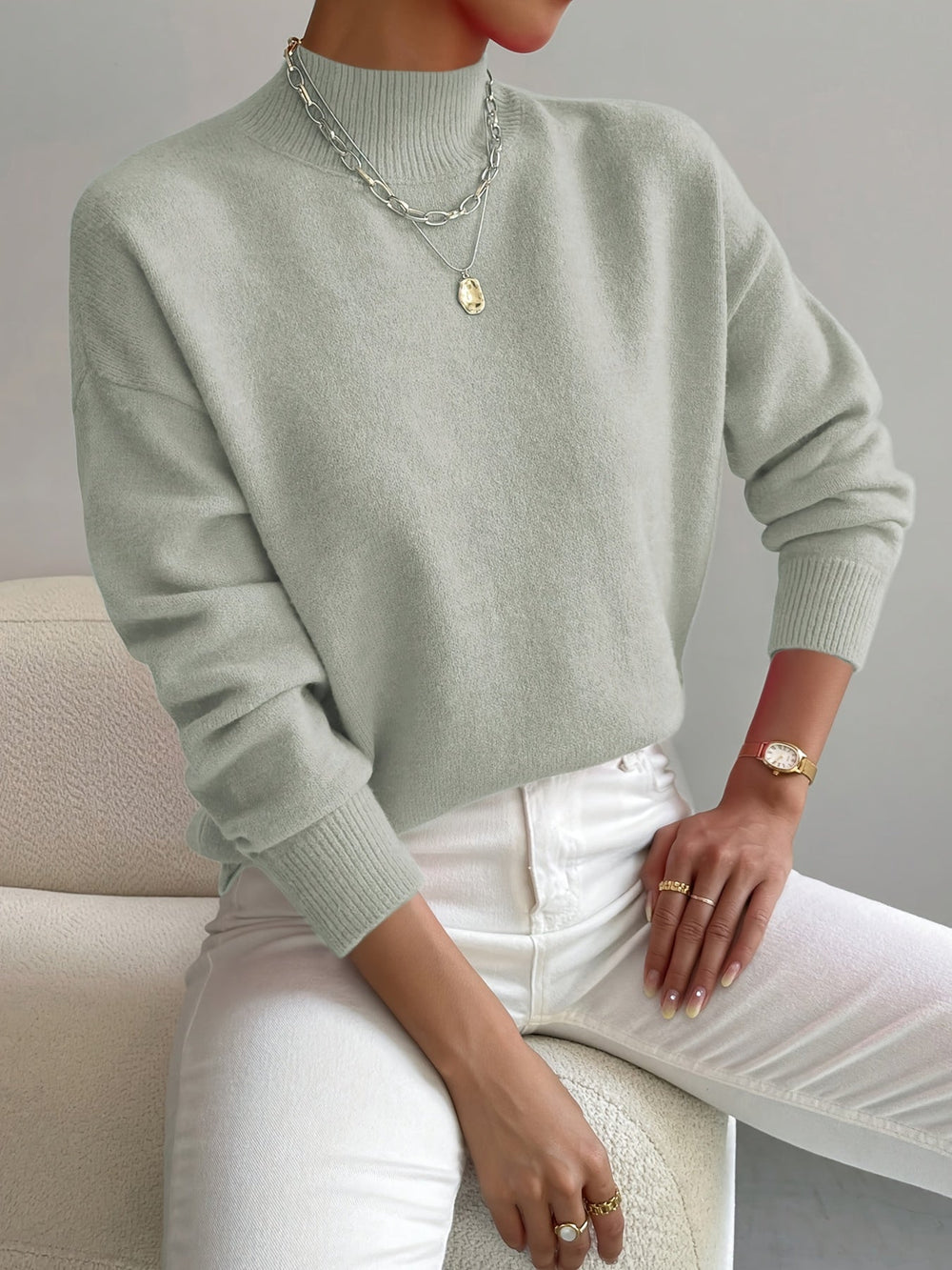 Prenda de punto elegante de cuello alto y cálida